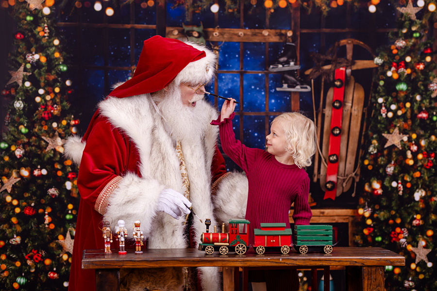 child enjoying her Santa pictures in Rolesville for Raleigh families