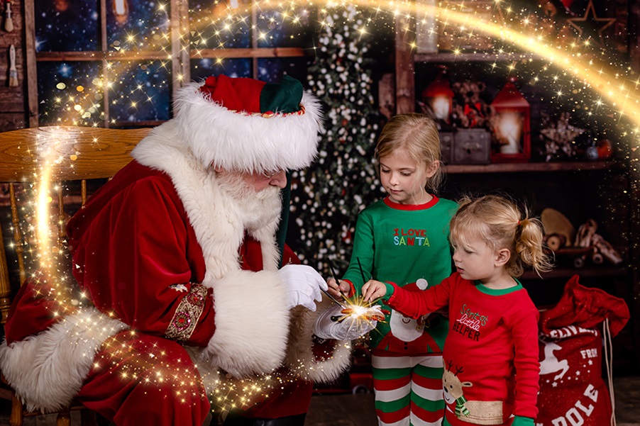 two girls paiting magic with santa in their Raleigh Santa Pictures shoot