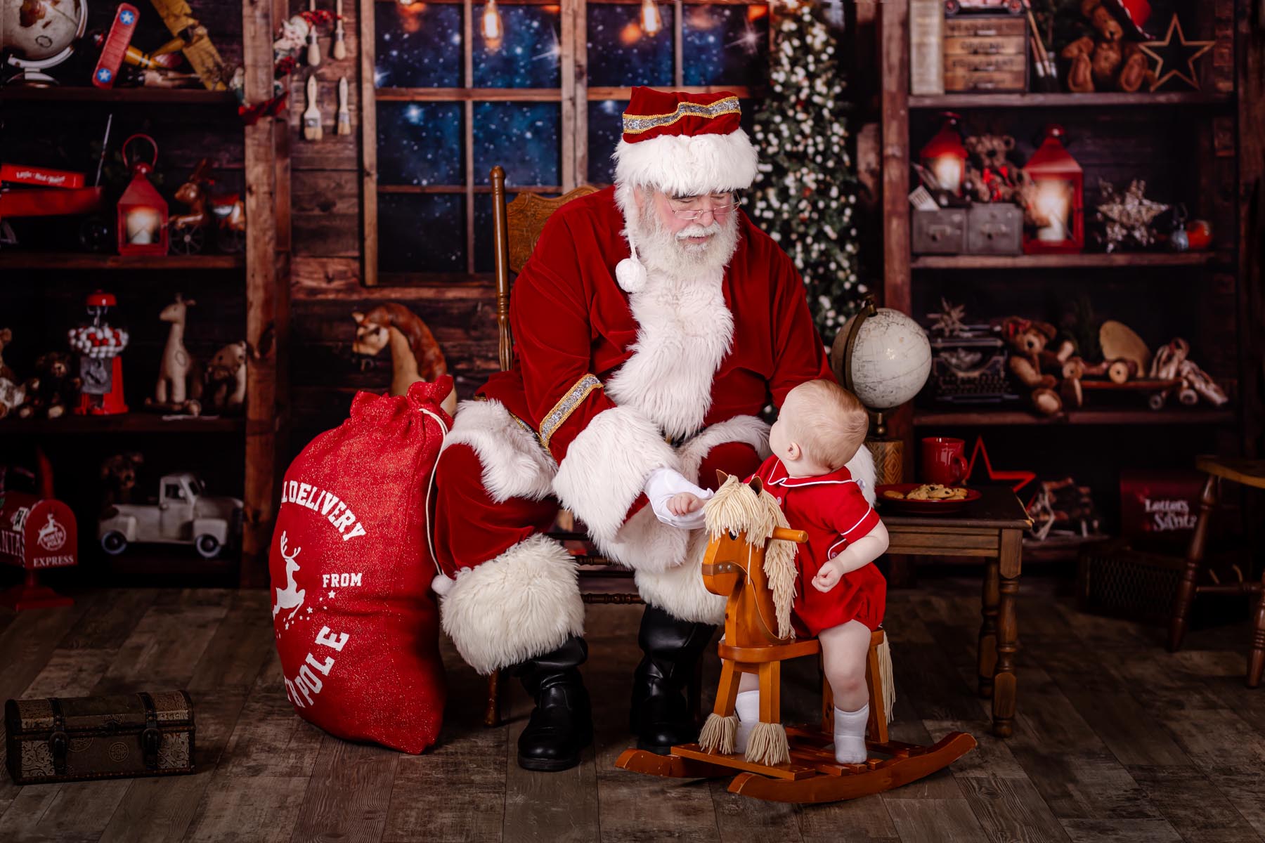 baby looking at santa claus